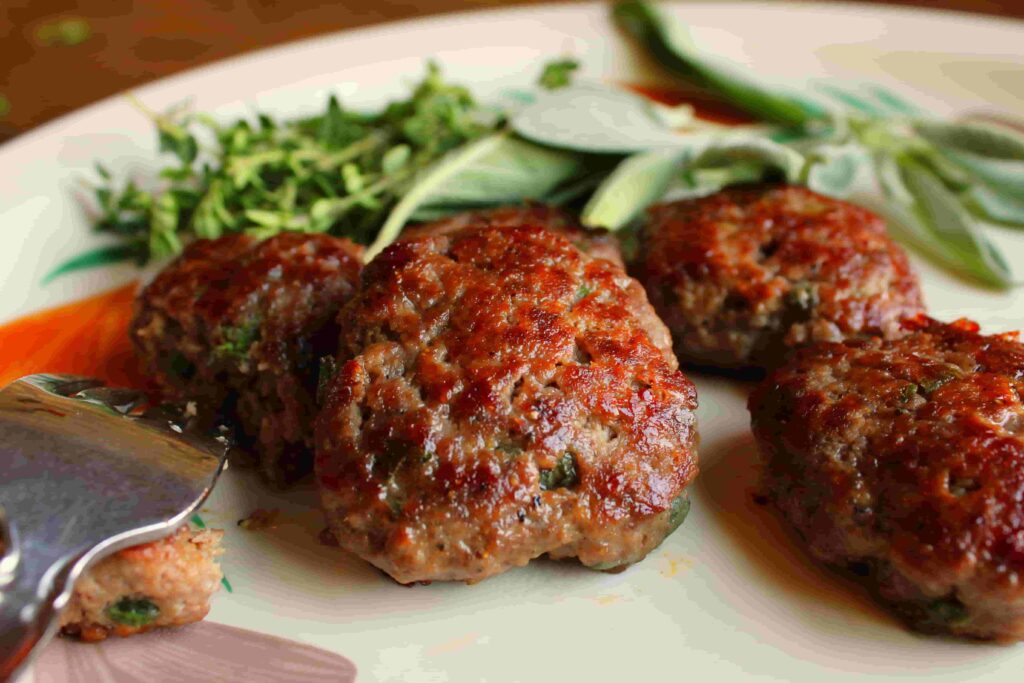 elk sausage patties on plate