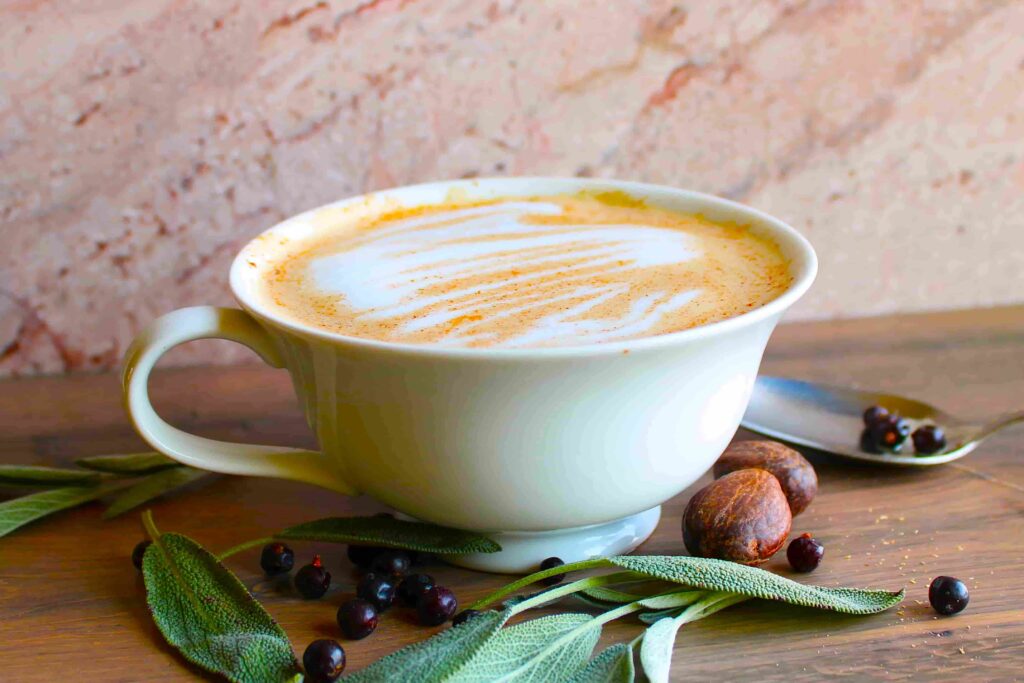 juniper latte recipe in mug with sage and nutmeg