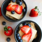 healthy baked yogurt dessert recipe in serving dishes with berries