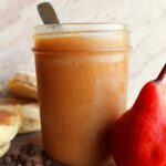 easy homemade pear butter in a jar with a fresh pear