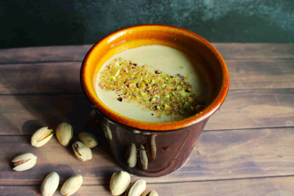 hot pistachio latte in brown mug