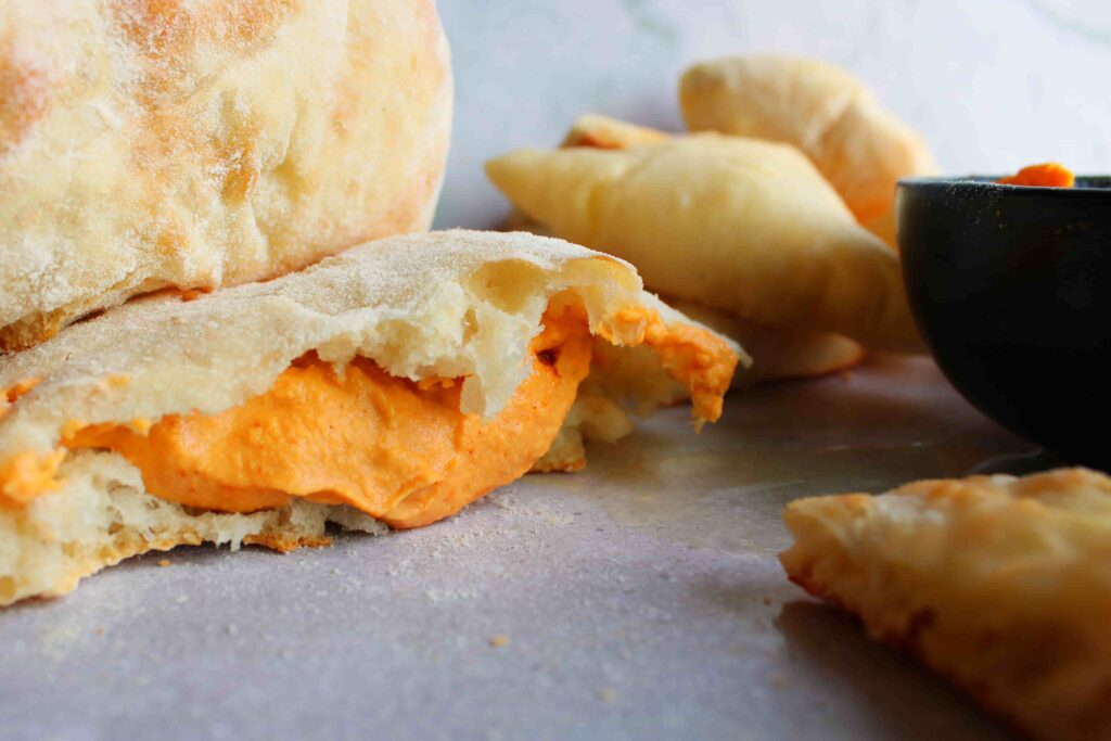 roasted red pepper hummus no tahini in a pita bread pocket